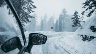 Driving on a snowy road, photo credit Syed Qaarif Andrabi on Pexels