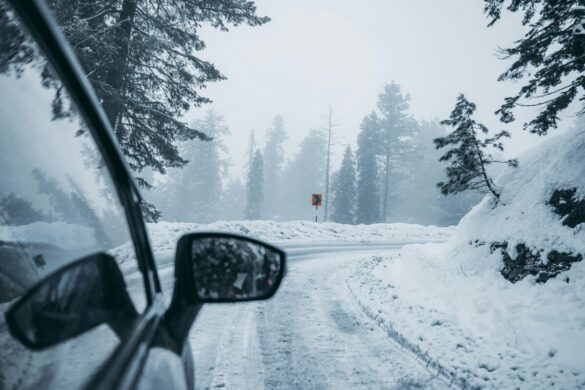 Driving on a snowy road, photo credit Syed Qaarif Andrabi on Pexels