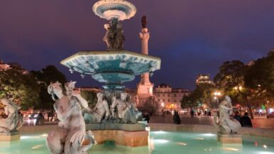 Mermaid statues and fountain Rossio Square Lisbon