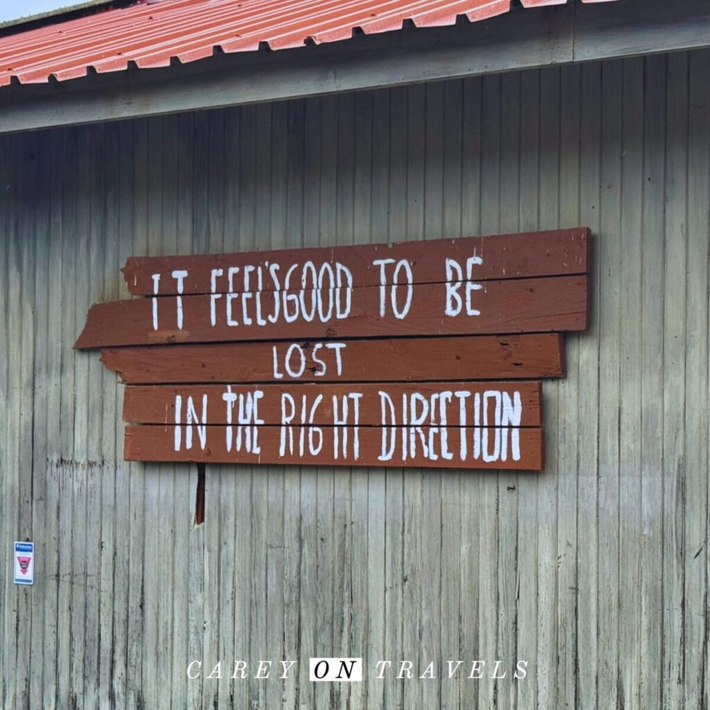 Lost in the Right Direction sign at Praia do Cavalho